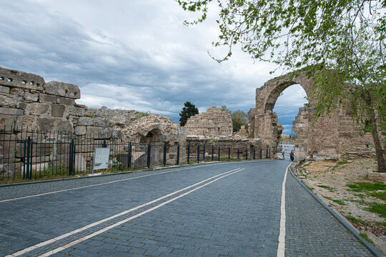 Side Ancient City. It shows the remains of an ancient structure and a stone-paved road passing through them. As indicated in the file name, these remains belong to the Vespasian Fountain and the Monum