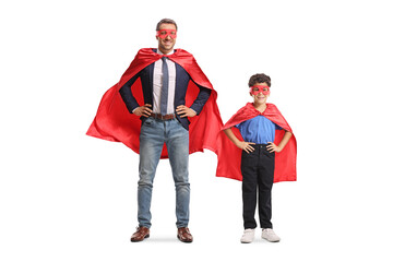 Man and a kid in superhero costumes posing together © Ljupco Smokovski