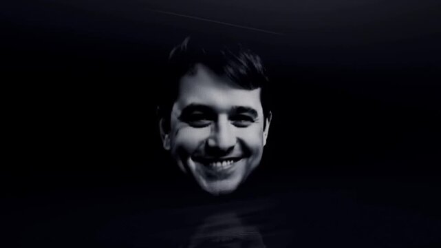 Smiling male portrait emerges from a dark reflective surface in monochrome animation. Technology presentations, psychology and mental wellness concepts, and creative advertising.