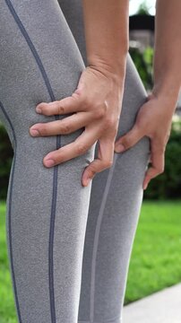 Women while exercising touching painful twisted or broken. Athlete training, running up and down stairs accident. Sport sprained sprain cause injury knee. and pain with leg bones.