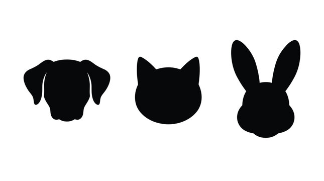 Dog cat and rabbit head silhouettes are displayed in a simple black and white composition silhouette
