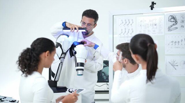 A team works together in a laboratory to design and test robotic parts, focusing on innovation and collaboration to solve complex technical challenges in modern engineering research.