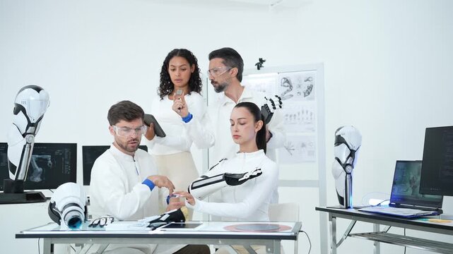 Team works together in a laboratory to design and test advanced robotic prosthetics, driving innovation and medical progress through teamwork and modern engineering research.