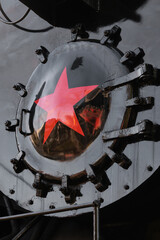 Fragment steam locomotives with red star. Retro steam train. Selective focus © VLAD ANTONOV
