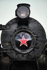Old steam locomotive with red star.  © VLAD ANTONOV