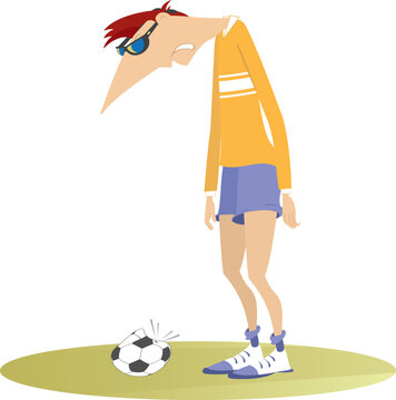 Puzzled football player stands near a broken ball