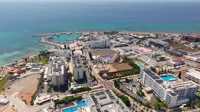 Ayia Napa, Cyprus. Drone View of Summer Resort Buildings, Marina and Mediterranean Sea