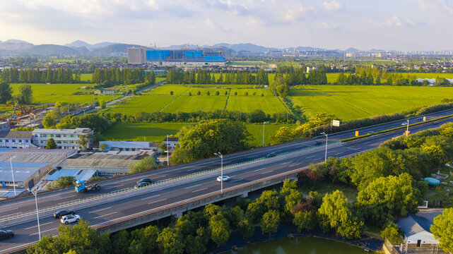 Aerial View of Highway Bridge and Green Fields in Hangzhou, China