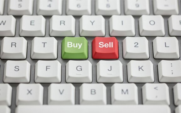 Computer keyboard with green buy and red sell keys, down macro view