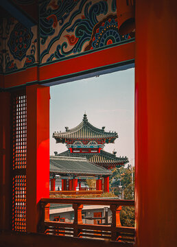 Traditional Chinese Pavilion Architecture Framed by Ornate Red Woodwork in Nanchang