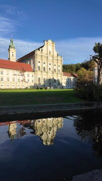 Fuerstenfeld Monastery in Fuerstenfeldbruck near Munich, Upper Bavaria: Baroque Cistercian abbey church with historic cloister courtyard and cultural heritage architecture