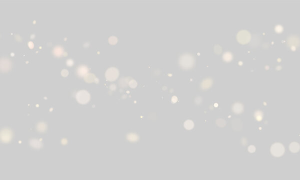 Warm bokeh light particles float against a black background. They vary in size and exhibit soft, diffuse glows with golden and brown hues. This image lends itself well to festive or cozy.