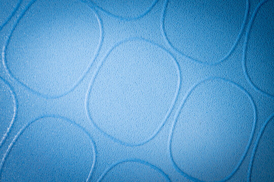 Bright blue background with repetitive oval shape pattern