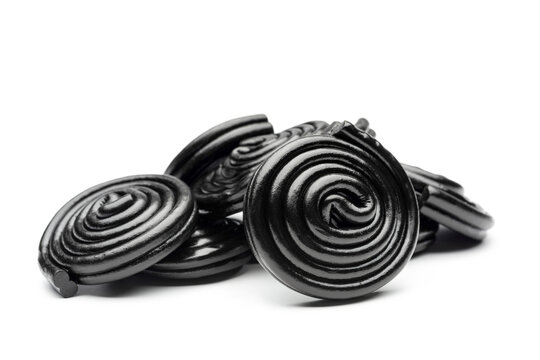 Liquorice candy wheels bunch, isolated on white background.