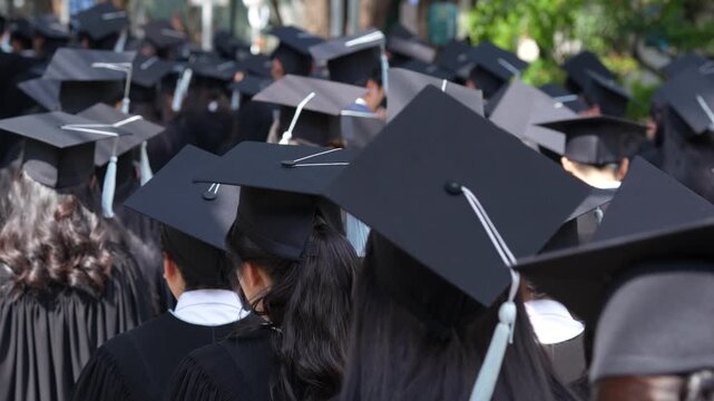 	
backside graduation hats during commencement success graduates of the university, Concept education congratulation. Graduation Ceremony ,Congratulated the graduates in University during commencement