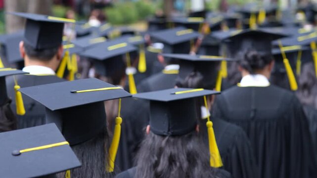 	
backside graduation hats during commencement success graduates of the university, Concept education congratulation. Graduation Ceremony ,Congratulated the graduates in University during commencement