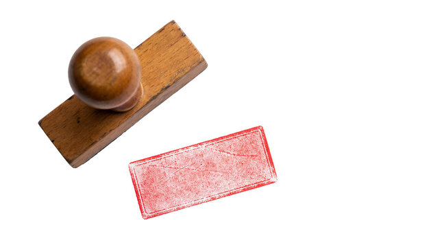 Wooden rubber stamp with blank rectangular red ink mark isolated