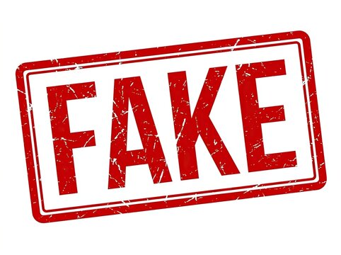 Red ink stamp with the word FAKE on a white background