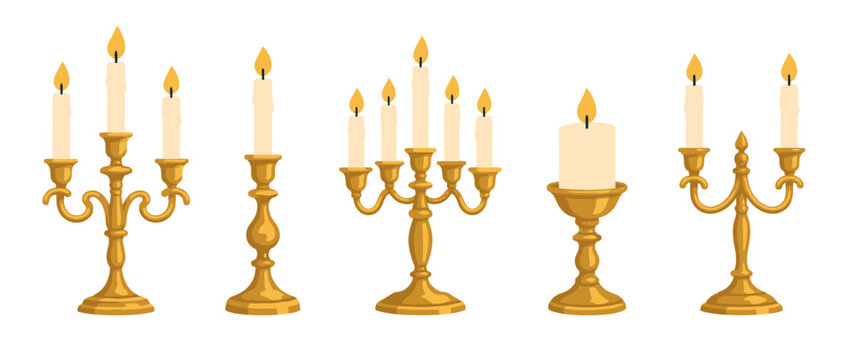 Set of golden candle holders and candelabra with lit candles
