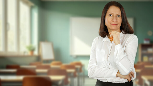 Female teacher or lecturer in classroom &ndash; education and academic learning concept.