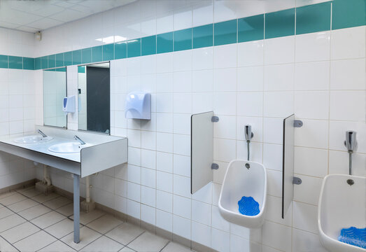 Restroom With Sinks and Urinals in a Public Space