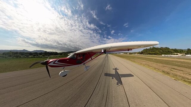 Private plane waving over a runway during take off from Cannes international Airport, selportrait, aerial view