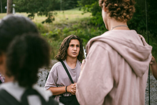 Boy talking with female counselor at summer camp