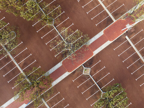 Aerial view of the parking lot at Percy Doyle Reserve with marked parking spaces and surrounding trees in Duncraig, Western Australia, Australia.