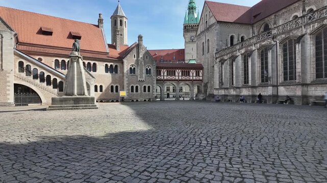 time-lapse with motion blur of people on historical Burgplatz (castle Square) in Braunschweig (Brunswick), Lower Saxony, Germany on a sunny day, 