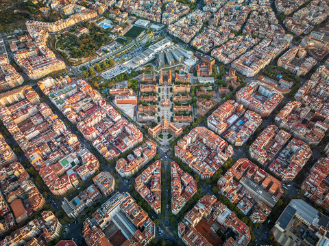 Aerial view of the historic Hospital de Sant Pau complex featuring its distinctive modernist architecture, red-tiled roofs, and surrounding urban grid layout in Barcelona, Catalonia, Spain.