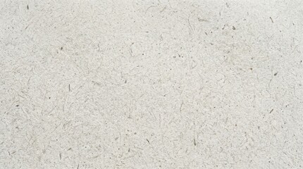 Fototapeta premium Close up of textured off white paper with subtle speckles.