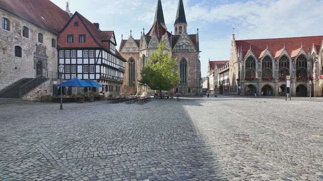 time-lapse with motion blur of people on historical Altstadtmarkt (old town market square) in Braunschweig, (Brunswick) lower saxony, germany