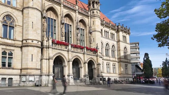 Town Hall of Brunswick, City Hall of Braunschweig on a sunny day, time-lapse with motion blur of people, Lower Saxony, Germany