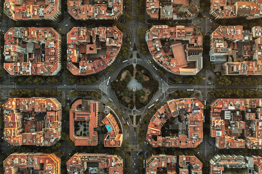 Aerial view of the Eixample district in Barcelona, showcasing the iconic grid layout, octagonal city blocks with inner courtyards, and a central roundabout, Barcelona, Catalonia, Spain.