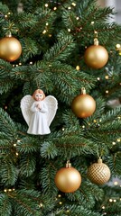 Fototapeta premium Christmas tree decorating with angel ornament and golden baubles