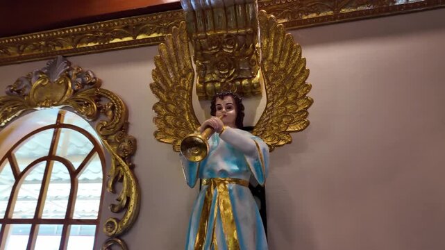 Angel statue with trumpet inside Simala Shrine in Cebu