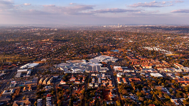Aerial view of Cresta Shopping Centre and Northcliff suburbs, with the Johannesburg CBD skyline in the distance, Johannesburg, Gauteng, South Africa.