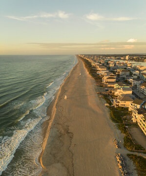 Aerial view of ocean front homes at sunrise in Carolina Beach, North Carolina, near Wilmington