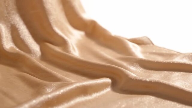 elegant gold shimmering fabric waves and soft satin folds background