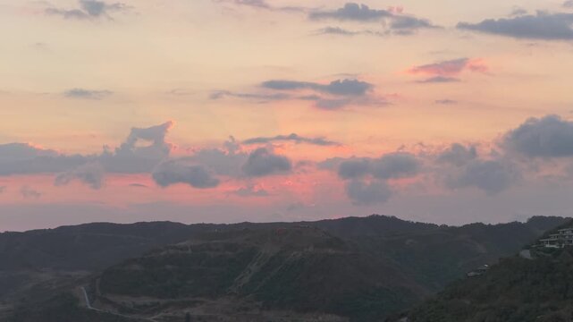 Beautiful sunset over hills of tampah beach in kuta lombok