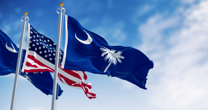 South Carolina state flags waving with the US flag