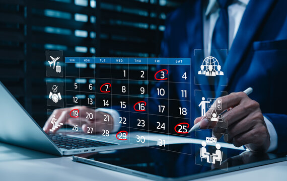 Time management and calendar planning concept. Businessman using laptop with digital calendar displaying marked dates, time management, scheduling, and agenda planning for business or personal tasks