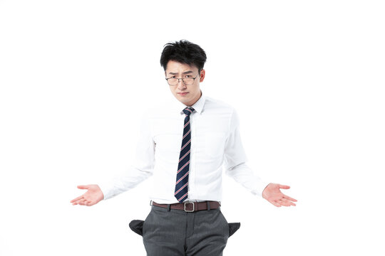 Frustrated businessman with empty pockets shrugging in financial struggle