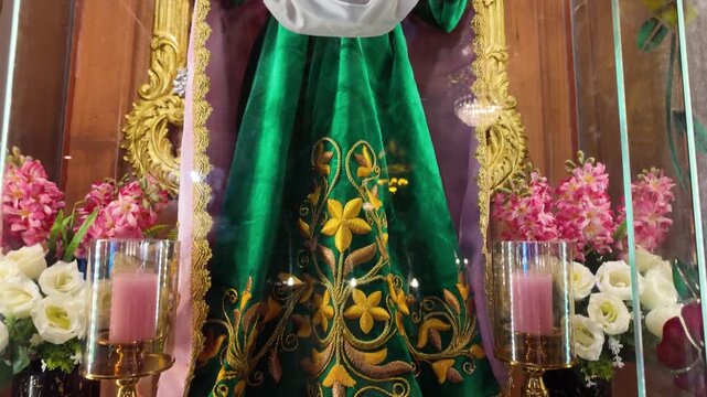 Religious statue in green robe at Simala Shrine in Cebu