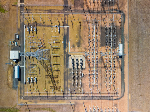 Aerial view of Millmerran Power Station featuring electrical transmission towers, transformers, and switchyard infrastructure in the industrial landscape of Domville, Queensland, Australia.
