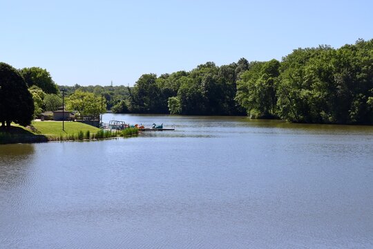 The peaceful lake in the woods on a sunny day.