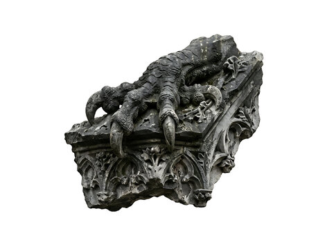 Stone sculpture of a dragon claw clutching a gothic architectural element isolated on transparent background