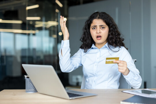 Frustrated woman experiencing online transaction problems with credit card
