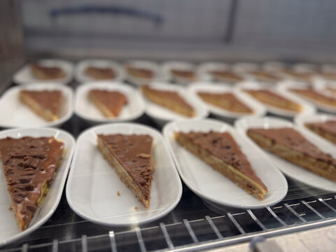 Chocolate pie slices in a bakery display case
