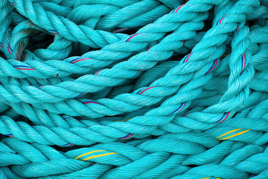Turquoise fishing ropes and marine lines in close-up